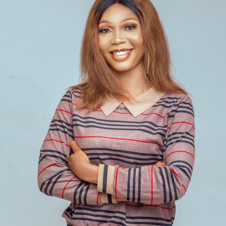 Kaveri Mehta, Lead Design Curator at Harbor Meadow Rift, reviewing corporate floral arrangements